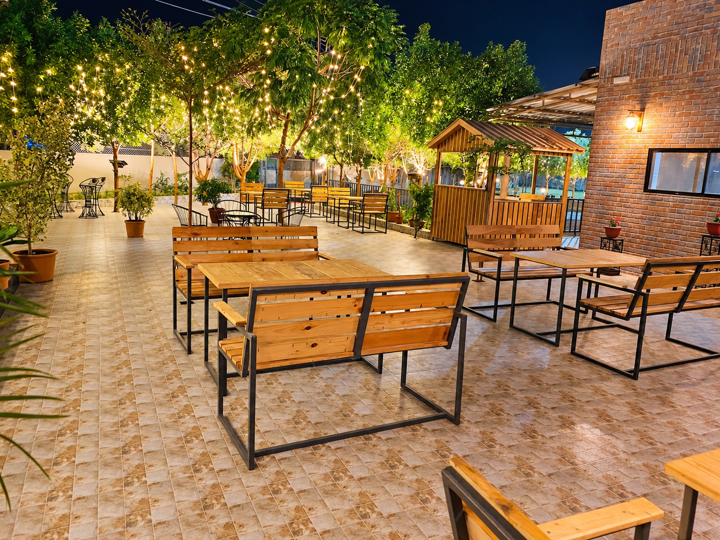 Tables under the trees at night