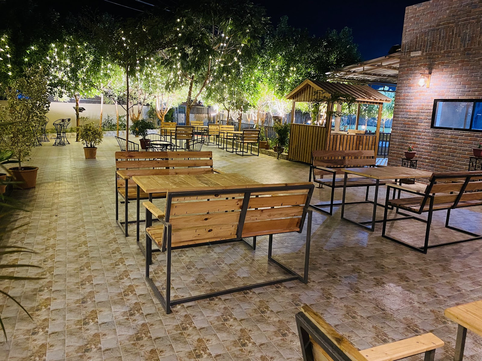 Tables under the trees at night