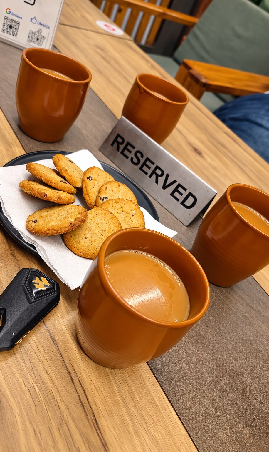 Masala tea in kulhads with cookies on a reserved table at The Leaf